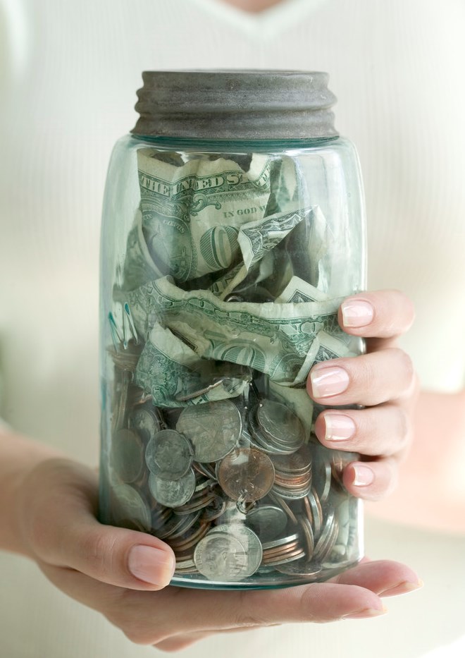 Jar of Money --- Image by © Royalty-Free/Corbis
