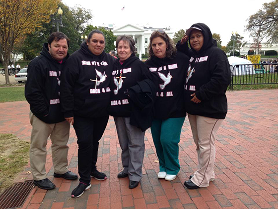Mendoza (second from left) with other advocates protesting outside the White House
