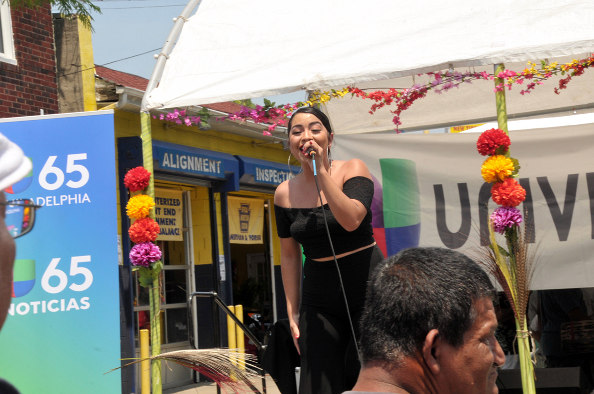 A Selena impersonator dazzles the Sugar Cane Festival attendees.