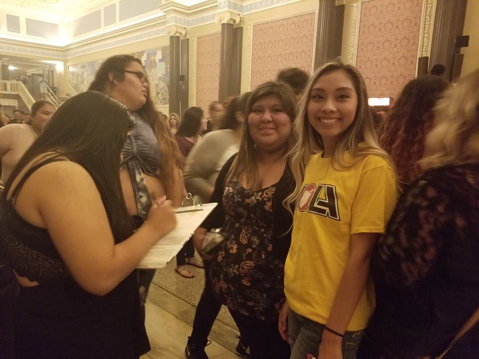 Susana Chavez registers young voters at a Bad Bunny concert in Cleveland on Sept. 20, 2017. | HOLA Ohio voter registration