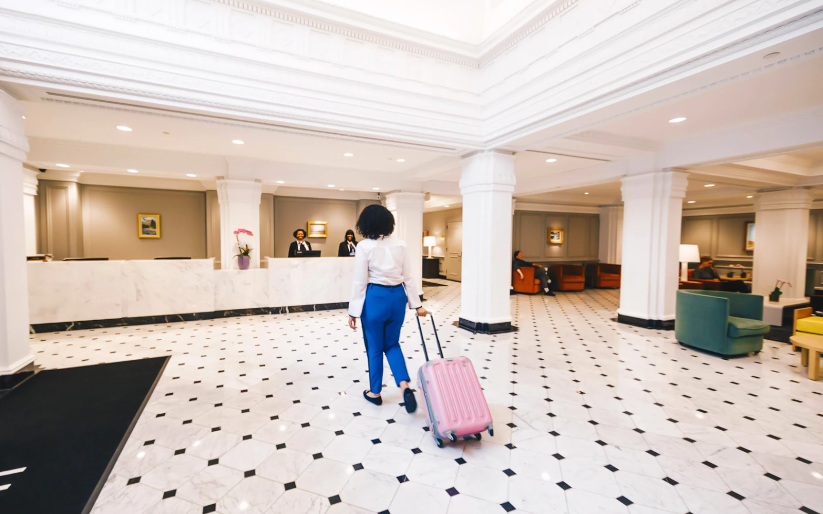 Hamilton Hotel lobby, woman walking to front desk