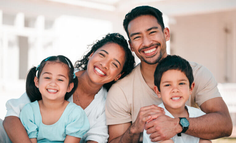 Latino family outside their home.