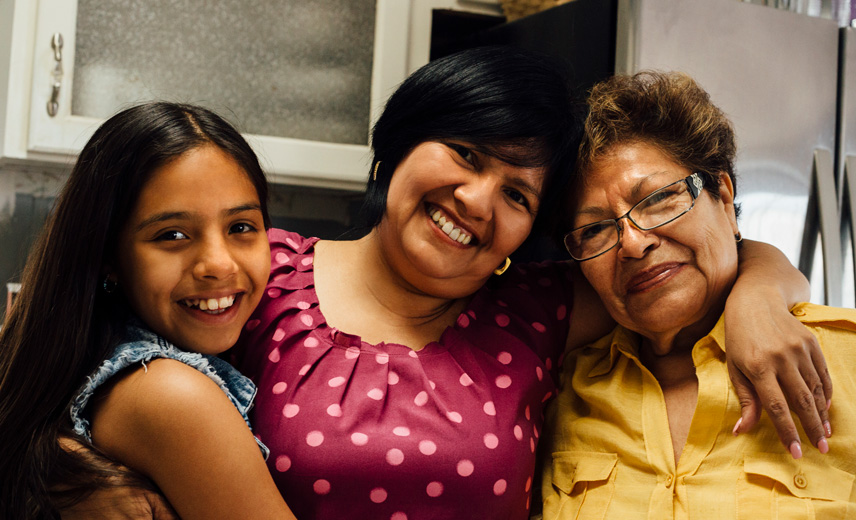 Portrait of a multi-generational Latino family (grandmother, mother, and daughter)