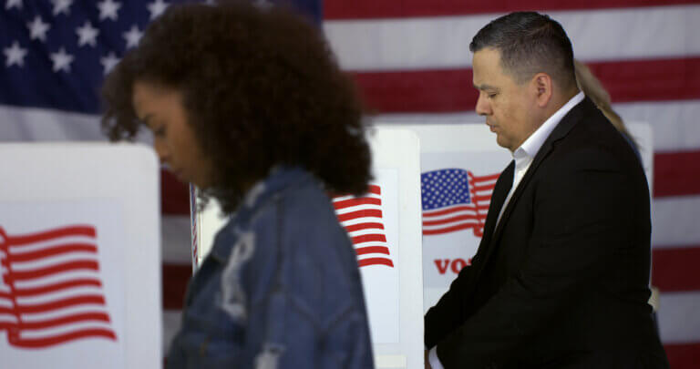 Hispanic man at polling station