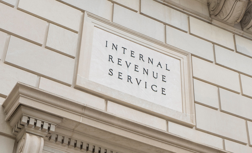 Closeup of the IRS sign seen at one of the entrances to the Internal Revenue Service (IRS) Building in Washington, DC.
