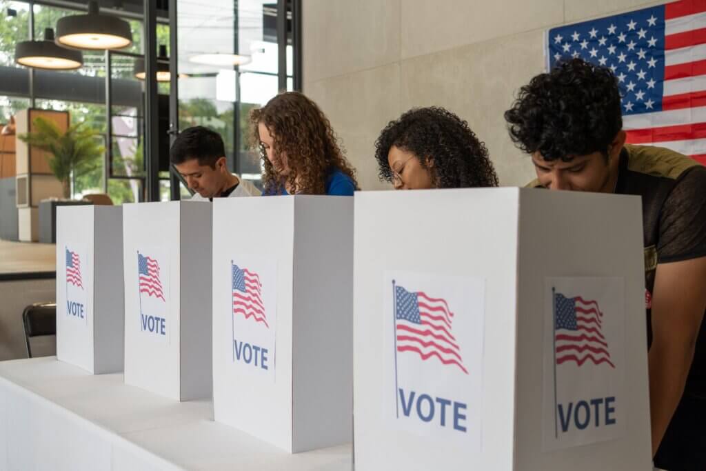 Group of multiethnic Americans at a voting booth
