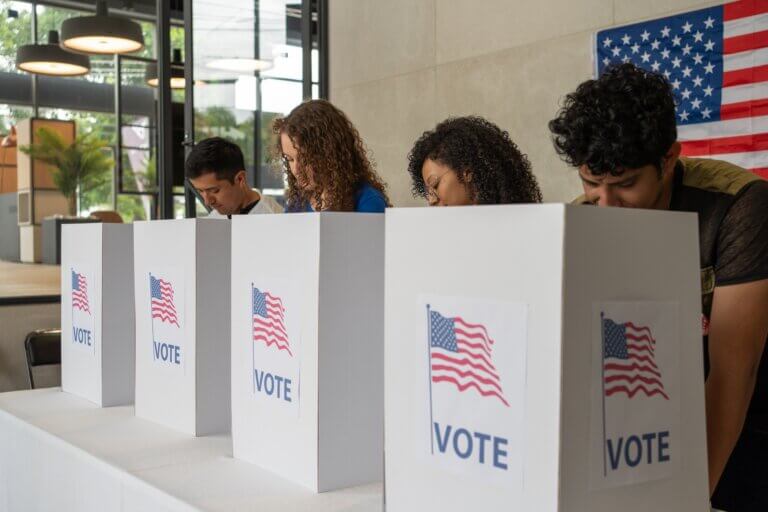 Group of multiethnic Americans at a voting booth